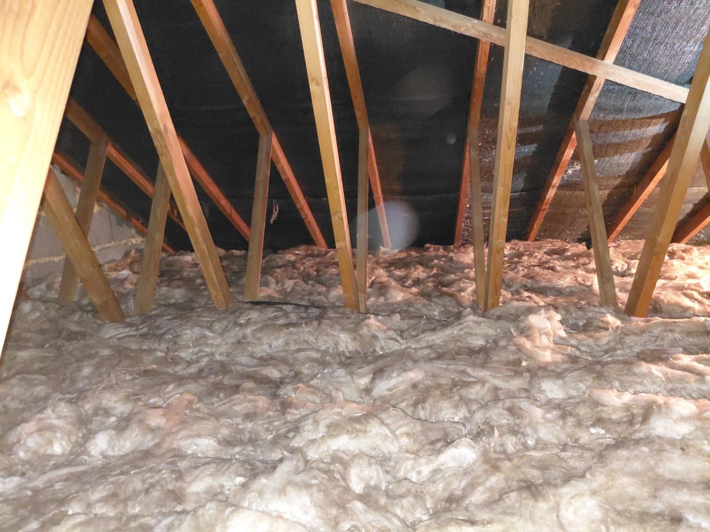 The same Walsall loft after our team laid fresh mineral wool insulation to the recommended 270mm depth, evenly covering the joists