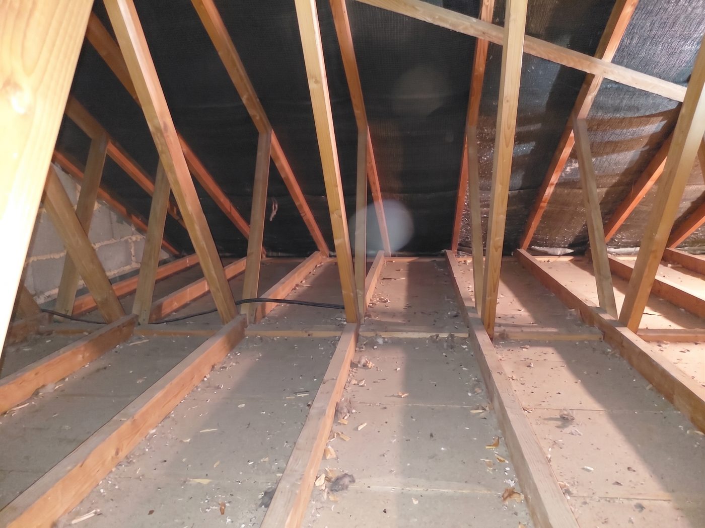Walsall loft before insulation — bare joists with little to no cover, letting heat escape straight through the roof